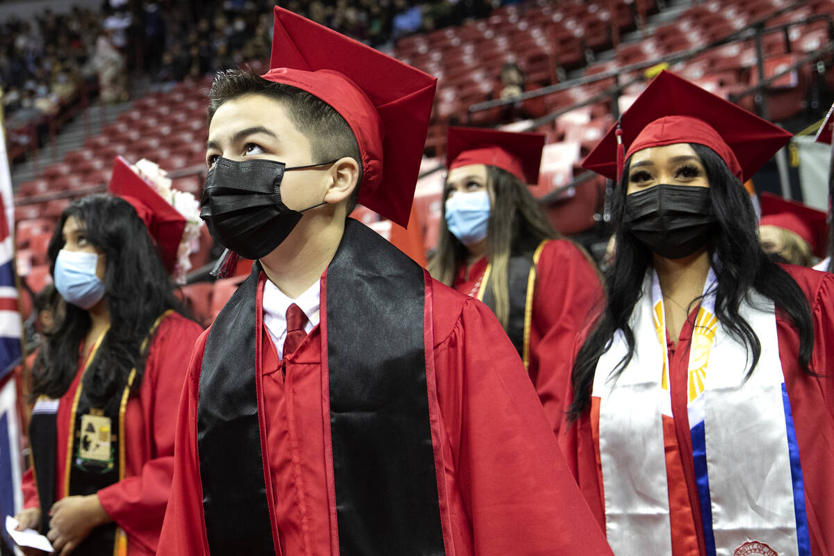 Jack Rico, a 15-year-old UNLV graduate in history, enters his commencement at the Thomas & ...