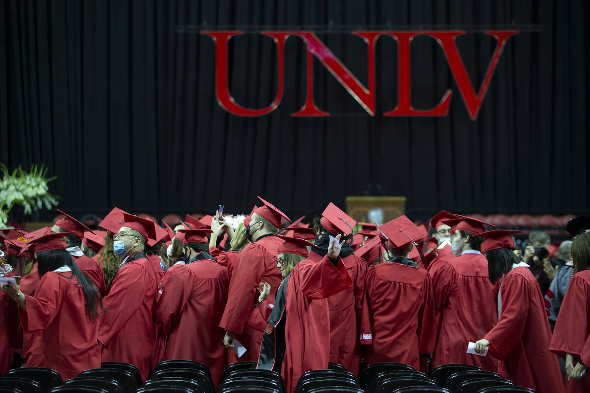 UNLV graduates proceed to their seats during their commencement at the Thomas & Mack Center ...
