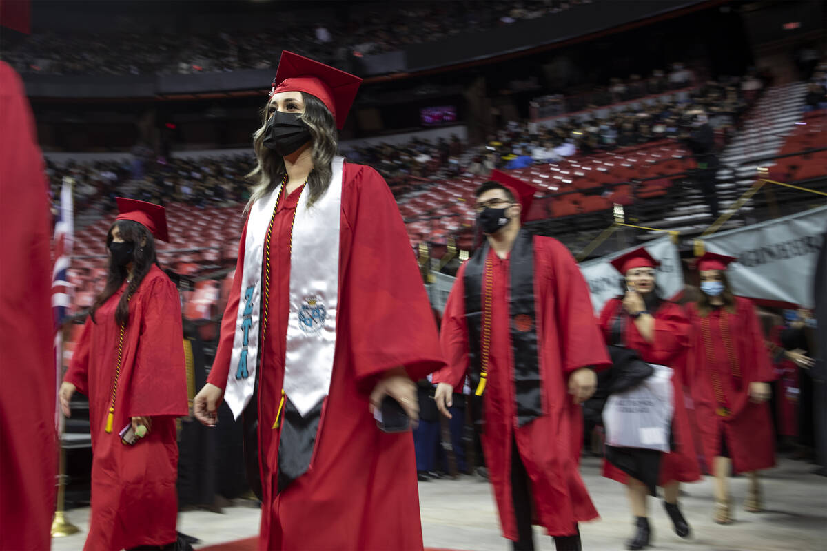 UNLV graduates enter the Thomas & Mack Center for their commencement on Tuesday, Dec. 14, 2 ...