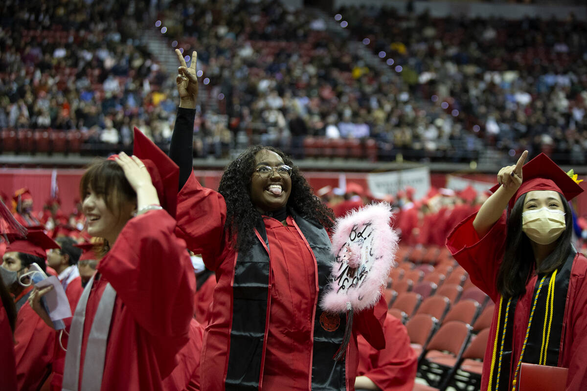 UNLV hospitality graduate Morgan Beasley, center, waves to family and friends during her commen ...