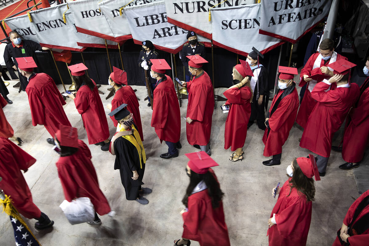 UNLV graduates line up to enter the Thomas & Mack Center for their commencement on Tuesday, ...