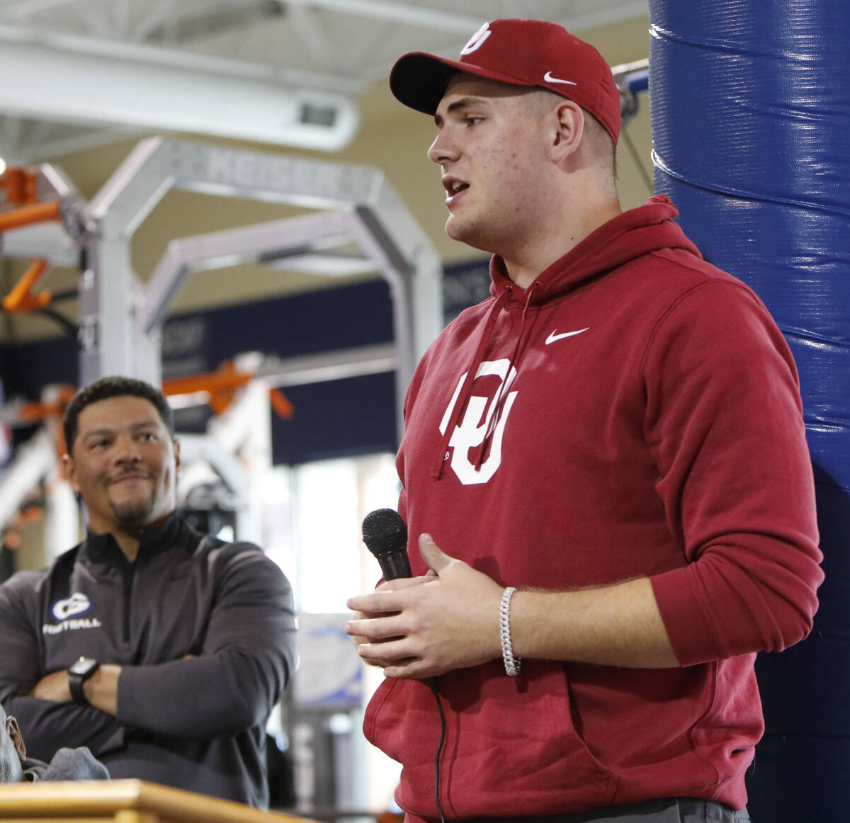 Bishop Gorman High School football player Jake Taylor, right, speaks before signing with Univer ...