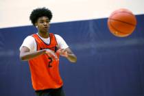 Keenan Bey passes the ball during a basketball practice at Bishop Gorman High School, Friday, N ...