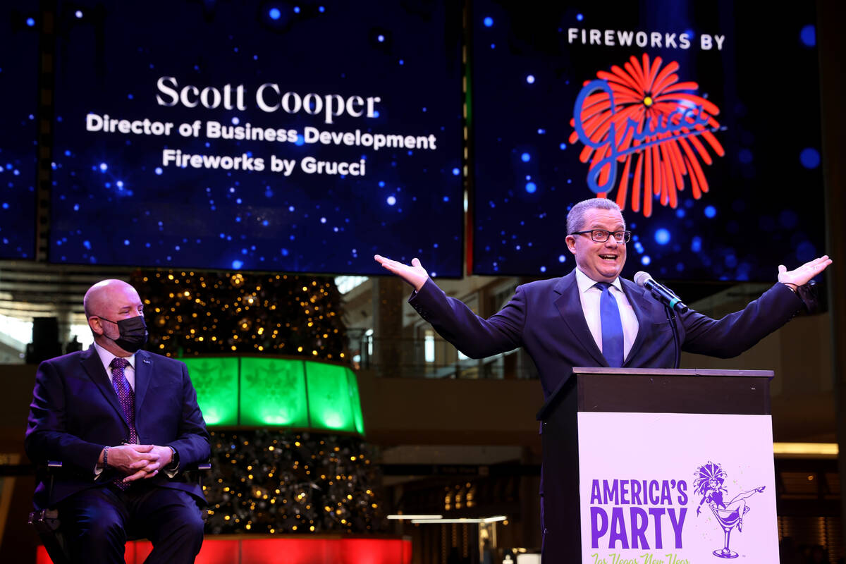 Fireworks by Grucci Director of Business Development Scott Cooper, right, talks during a Las Ve ...