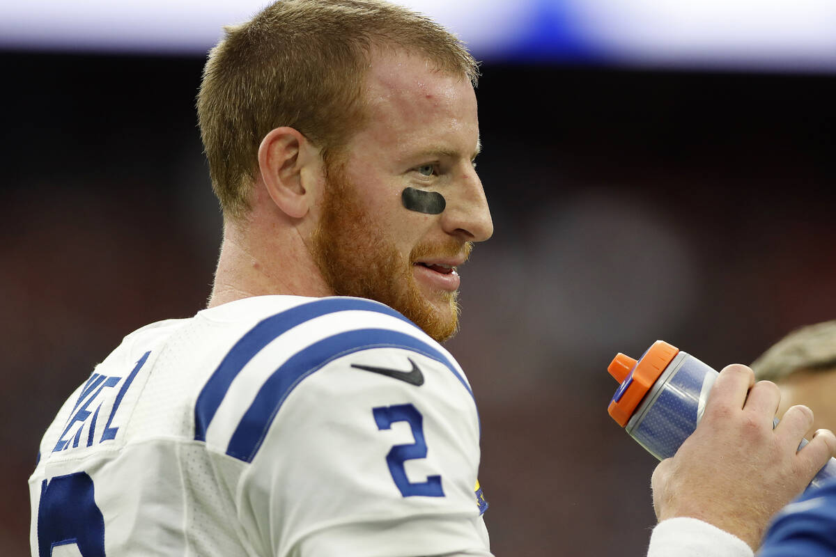 Indianapolis Colts quarterback Carson Wentz (2) waits for play to resume during an NFL football ...