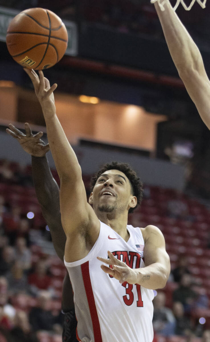 UNLV Rebels guard Marvin Coleman (31) drives past a Omaha Mavericks defender in the first half ...