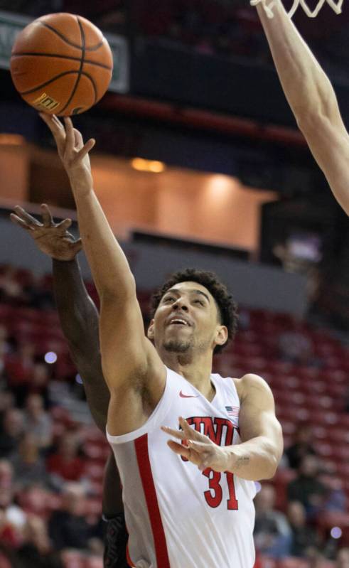 UNLV Rebels guard Marvin Coleman (31) drives past a Omaha Mavericks defender in the first half ...