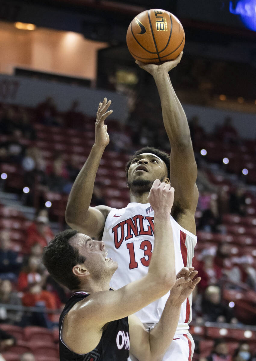 UNLV Rebels guard Bryce Hamilton (13) shoots over Omaha Mavericks center Dylan Brougham (14) in ...