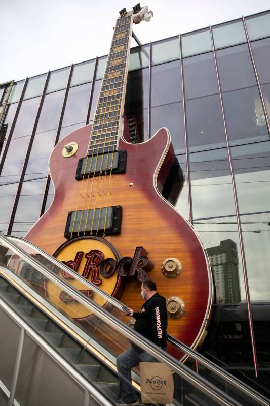 An enormous guitar adorns the outside of a Hard Rock Cafe on Thursday, Dec. 16, 2021, on the La ...