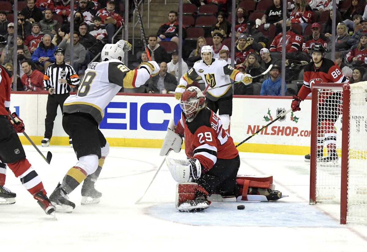 Vegas Golden Knights left wing William Carrier (28) celebrates after scoring a goal past New Je ...