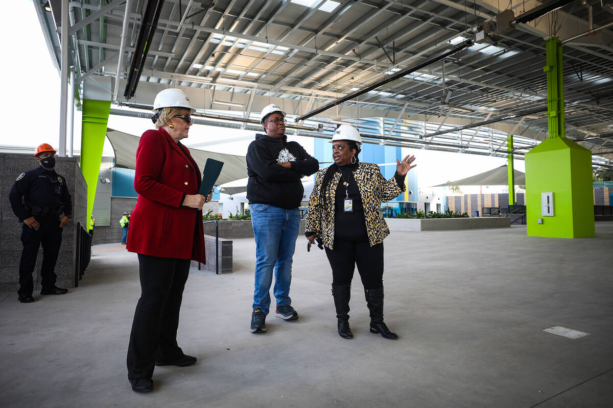 Kathi Thomas, director of community services for the city of Las Vegas, far right, leads a tour ...