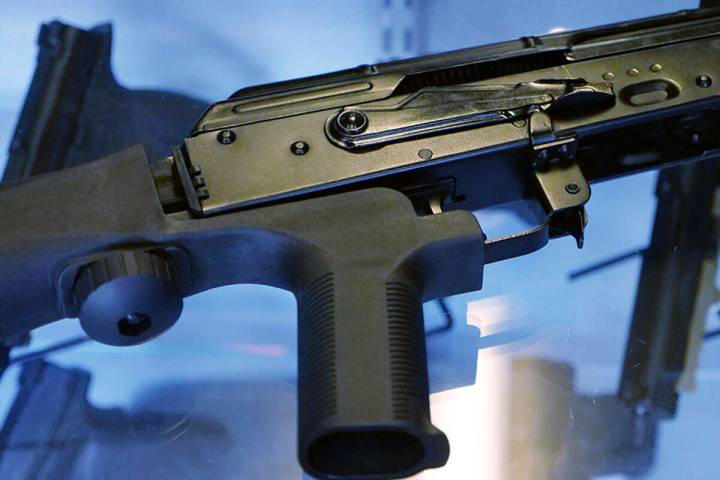 FILE - In this Oct. 4, 2017 file photo, a device called a "bump stock" is attached to a semi-au ...