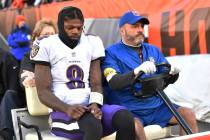 Baltimore Ravens quarterback Lamar Jackson (8) is carted off the field after an injury during t ...