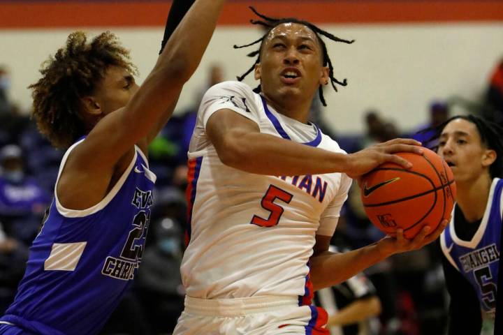 Bishop Gorman High School's Darrion Williams (5) shoots over Evangel Christian School's Christi ...