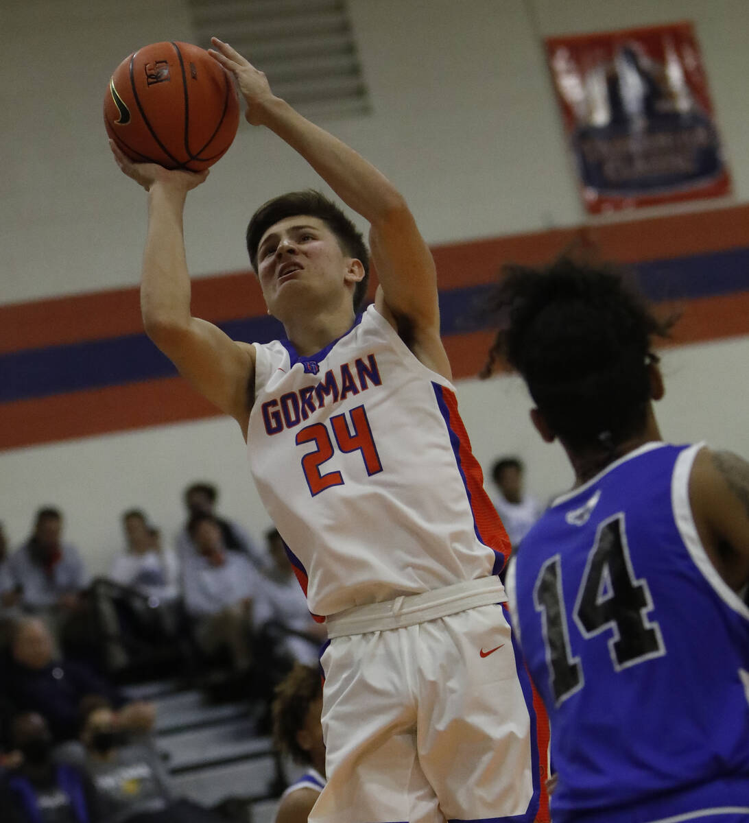 Bishop Gorman High School's Ryder Elisaldez (24) goes to the basket in the first half of a Tark ...