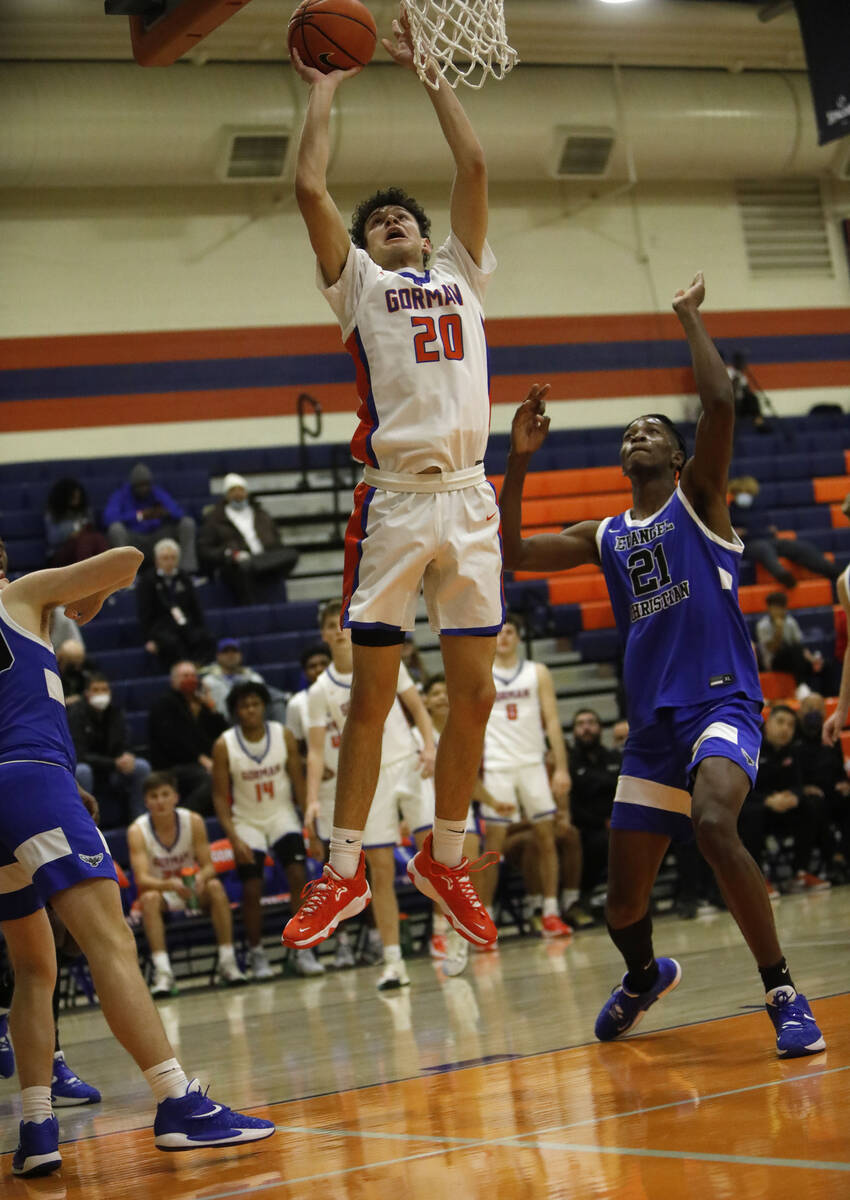 Bishop Gorman High School's Hayden Dunn (20) goes to the basket in the second half of a Tarkani ...
