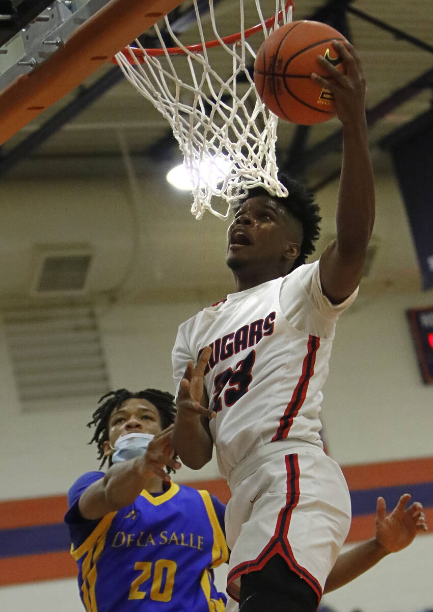 Coronado's Josiah Cunningham (23) shoots over De La Salle's Jamil Wilson (20) in the first half ...