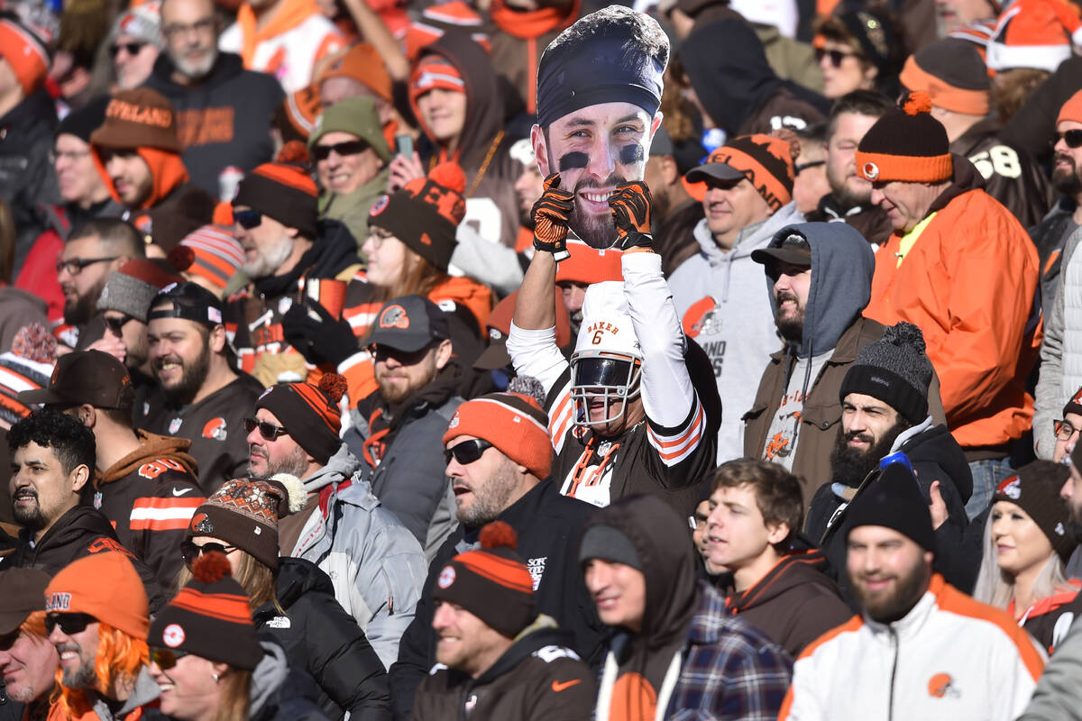 A fan holds a Baker Mayfield cutout during an NFL football game against the Baltimore Ravens, S ...