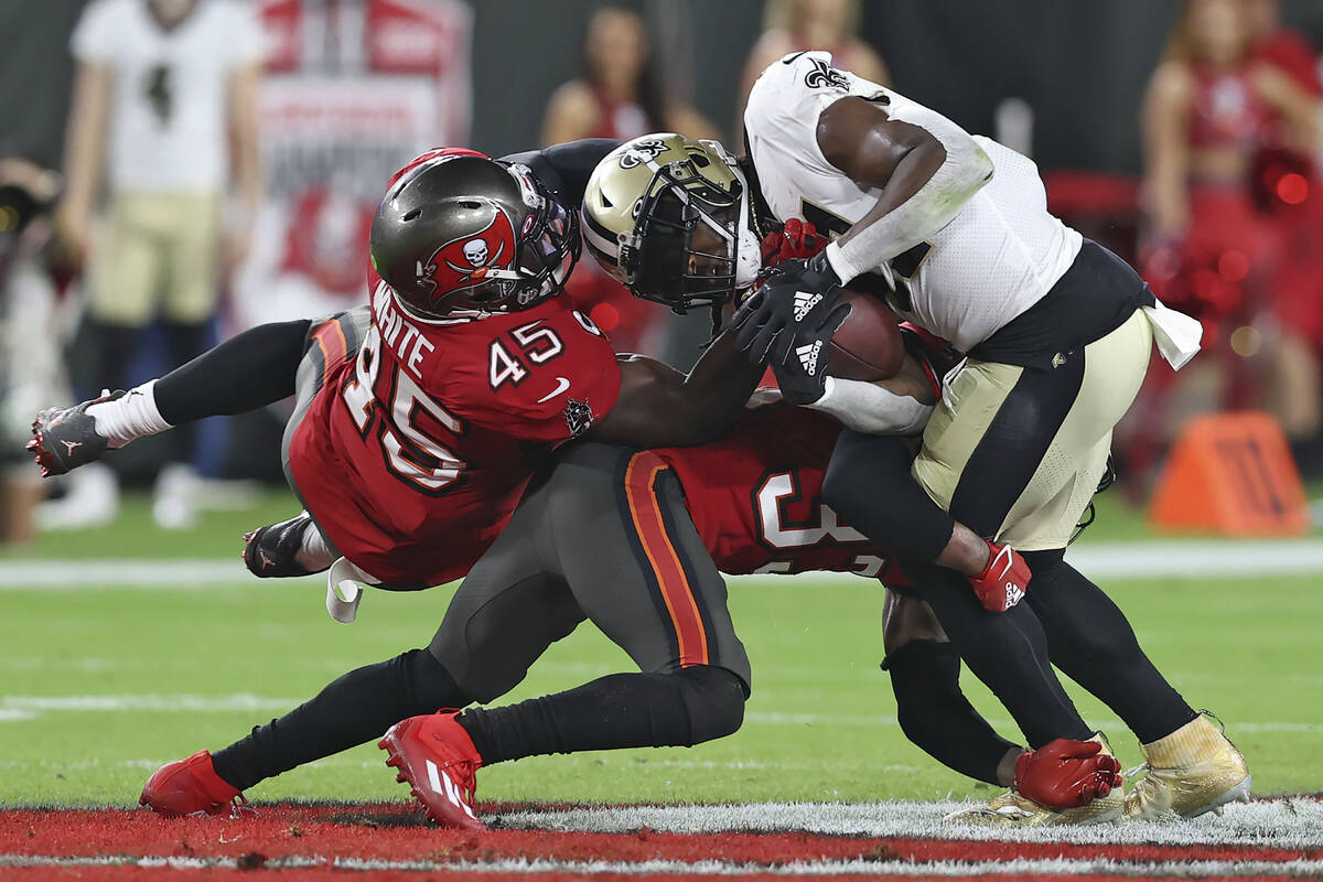 Tampa Bay Buccaneers inside linebacker Devin White (45) and free safety Jordan Whitehead (33) t ...