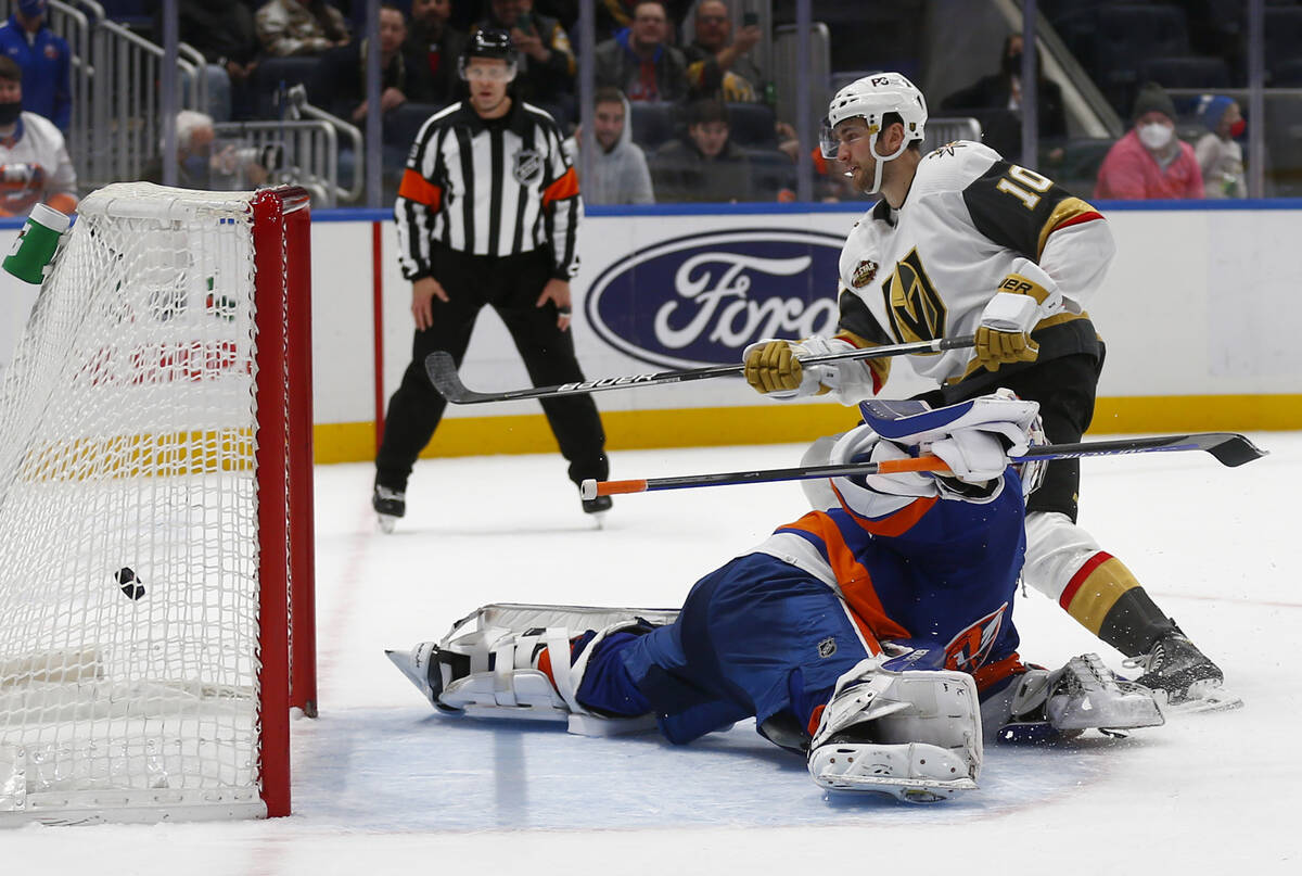 Vegas Golden Knights' Nicolas Roy (10) scores the winning penalty shot past New York Islanders' ...