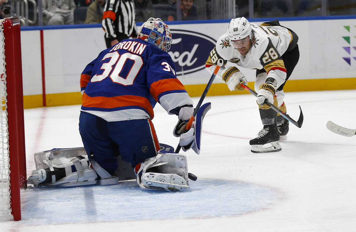 New York Islanders goalie Ilya Sorokin (30) makes a save on Vegas Golden Knights' William Carri ...