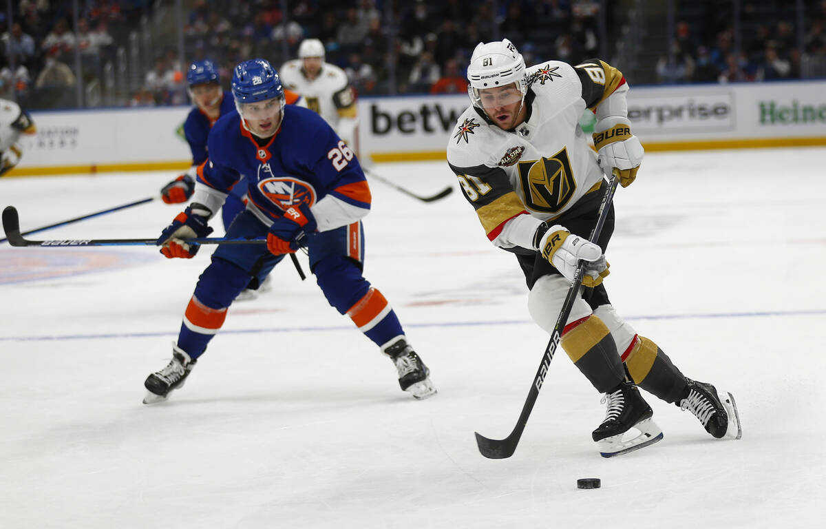Vegas Golden Knights' Jonathan Marchessault skates around New York Islanders' Oliver Wahlstrom ...