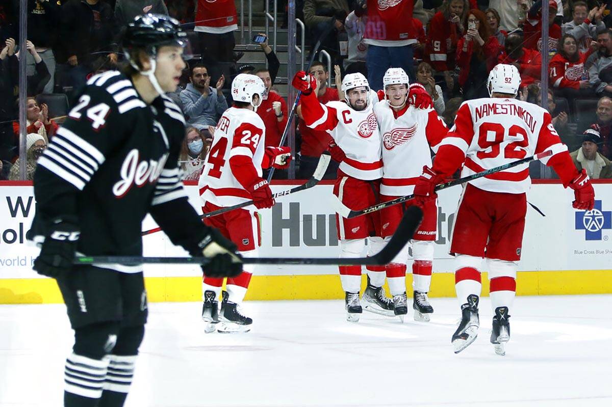 Detroit Red Wings center Dylan Larkin, third from left, celebrates his second goal of the game ...