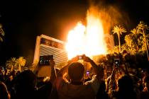 A large crowd gathers to watch the volcano erupt at The Mirage on the Las Vegas Strip. (Benjami ...