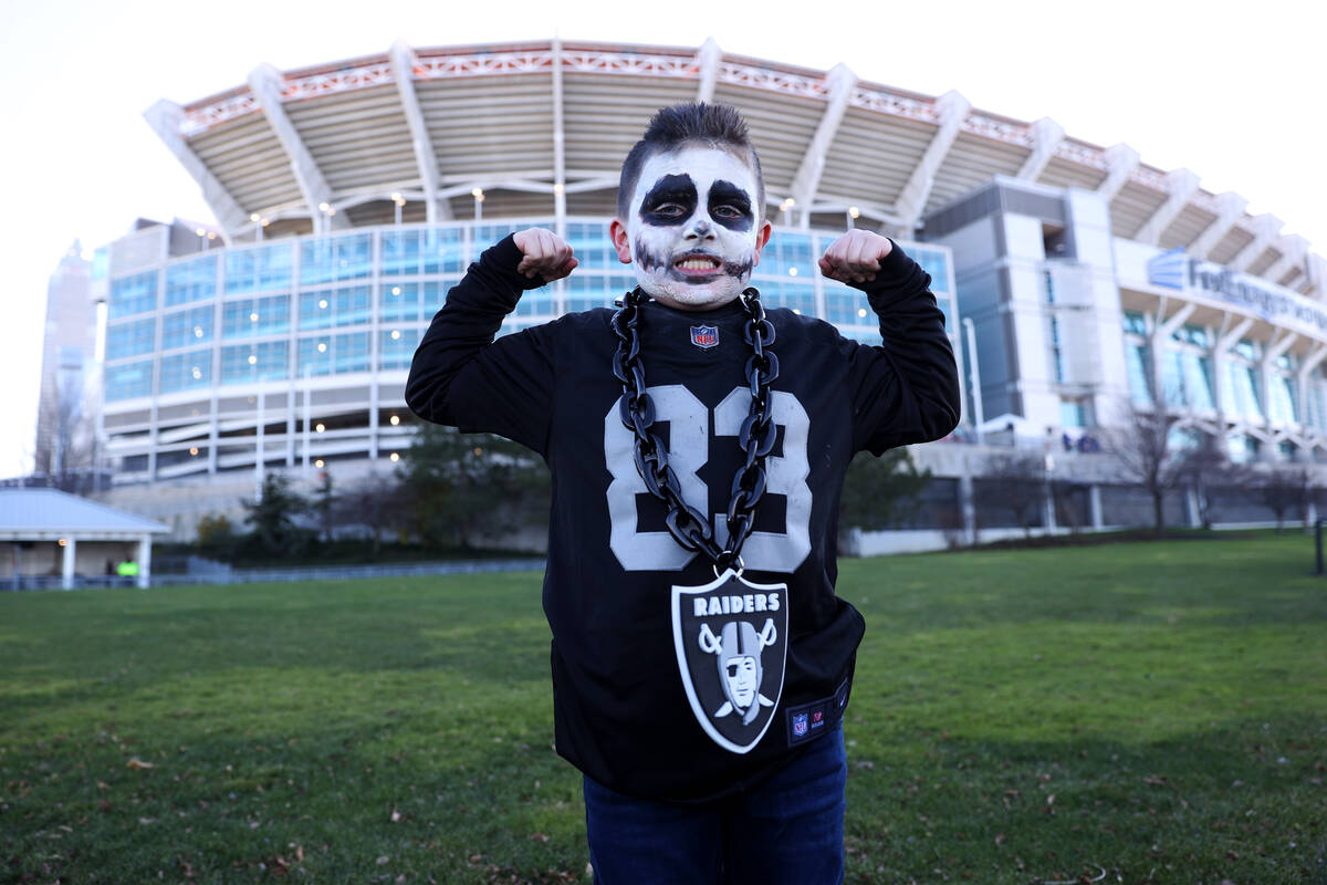 Xavier DeShong, 8, of Pennsylvania, poses before an NFL football game between the Raiders and t ...