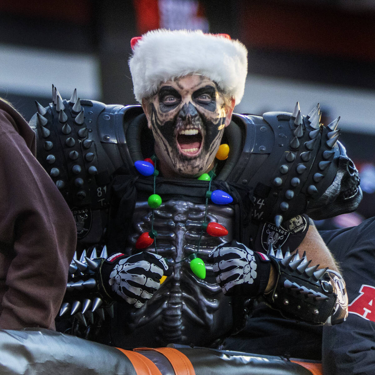 A Raiders fan poses before an NFL football game against the Cleveland Browns on Monday, Dec. 20 ...