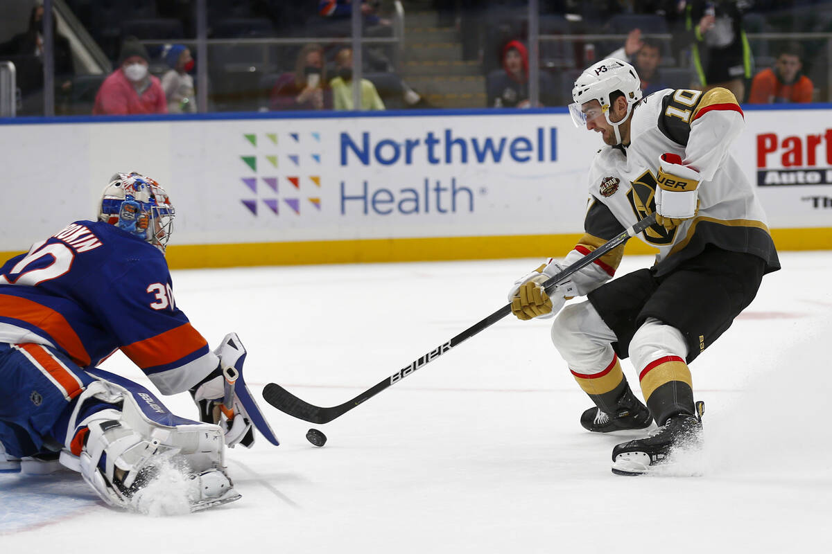 Vegas Golden Knights' Nicolas Roy (10) scores the winning penalty shot past New York Islanders' ...
