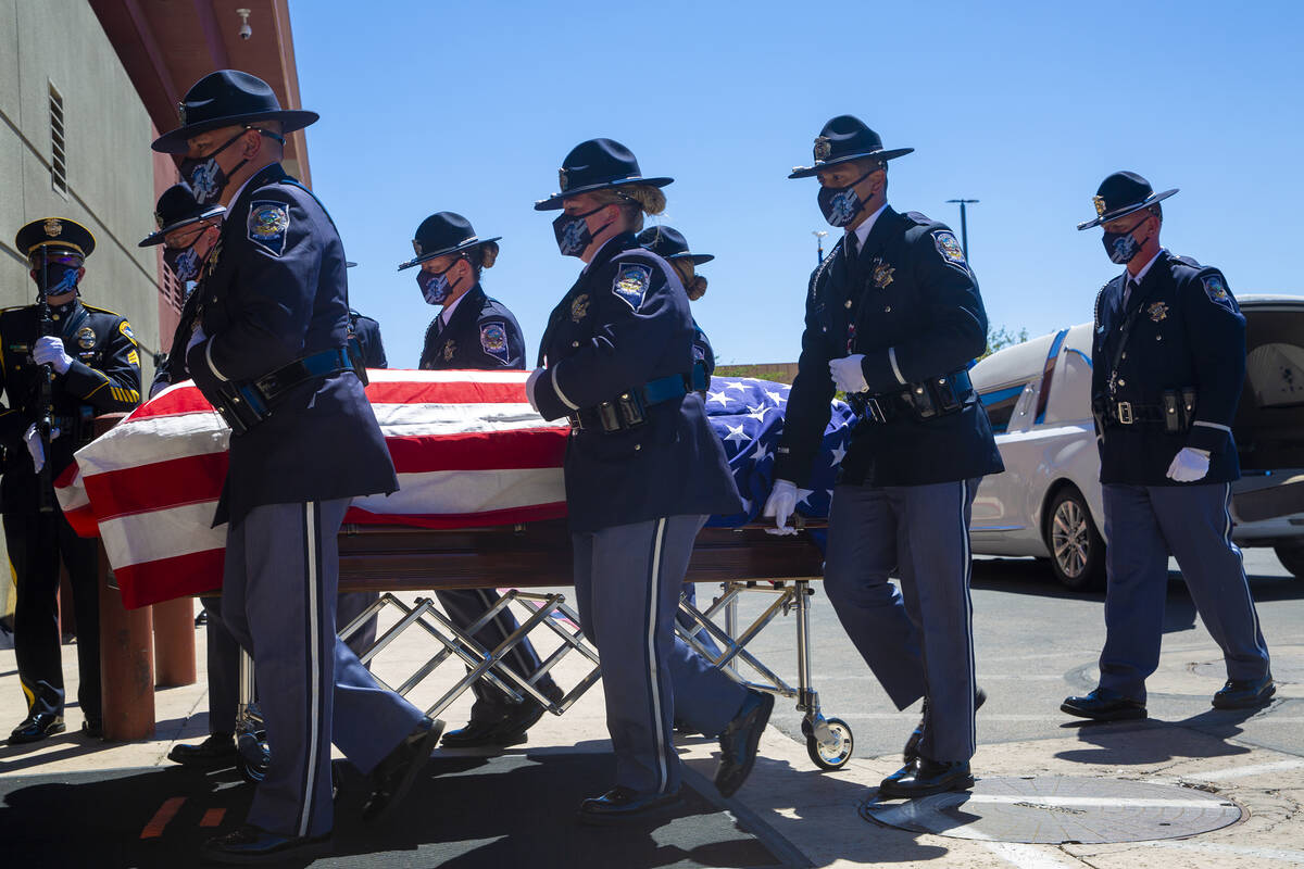 Members of the Honor Guard move Nevada Highway Patrol trooper Micah May's casket into his memor ...