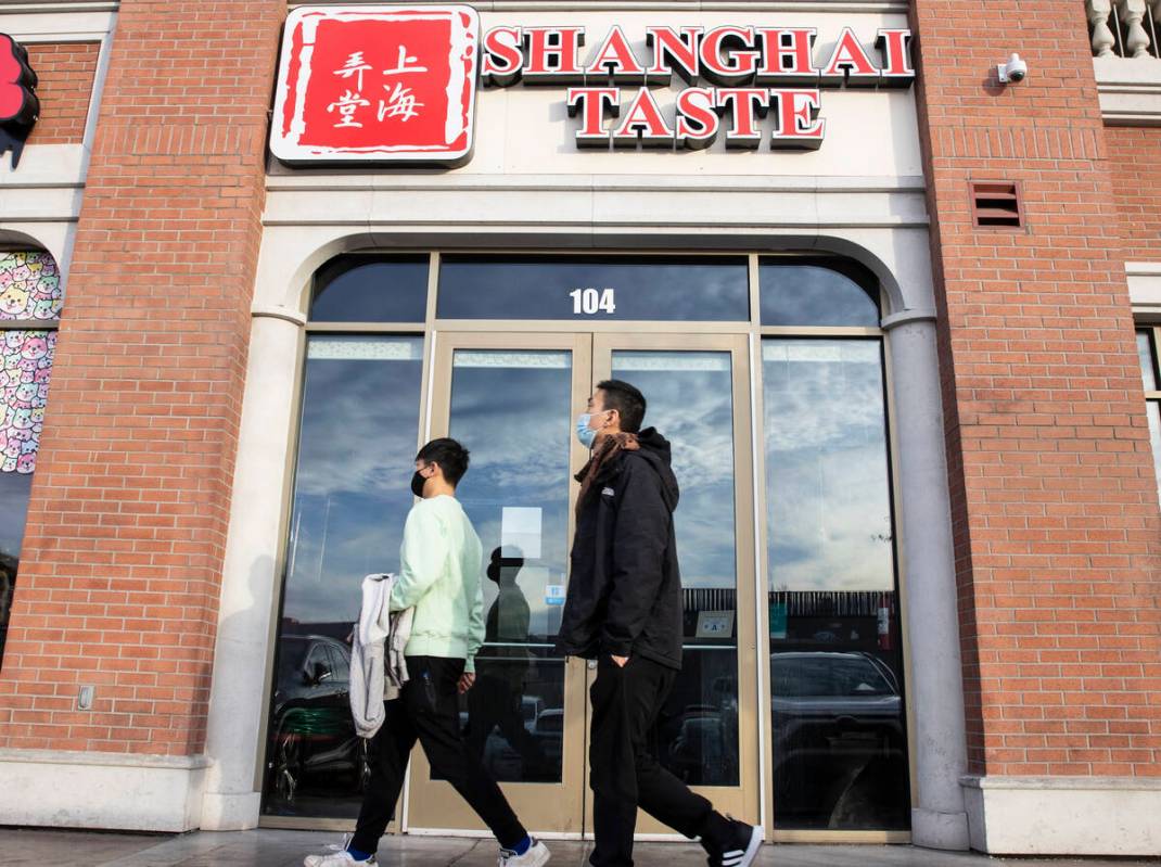 Pedestrians walk past Shanghai Taste at 4255 Spring Mountain Road in China Town on Monday, Dec. ...