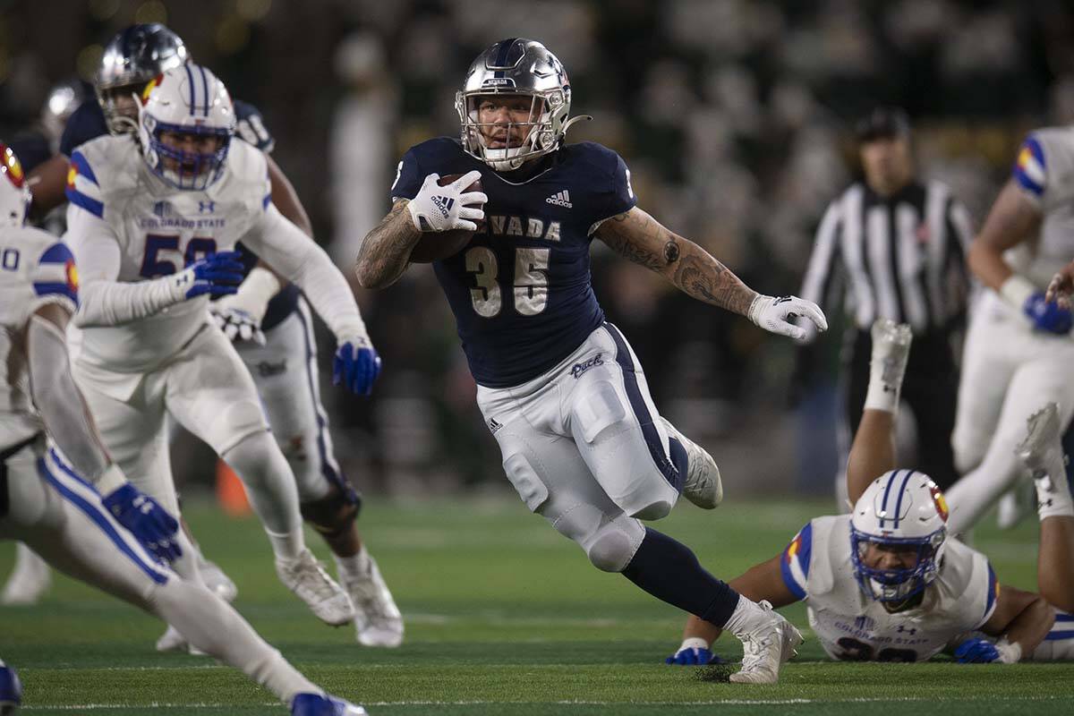 UNR running back Toa Taua carries against Colorado State during an NCAA college football game S ...