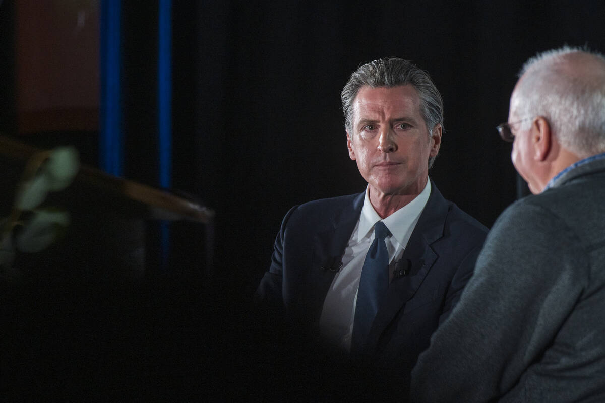 California Gov. Gavin Newsom, left, talks with Lenny Mendonca, leadership council member of Cal ...