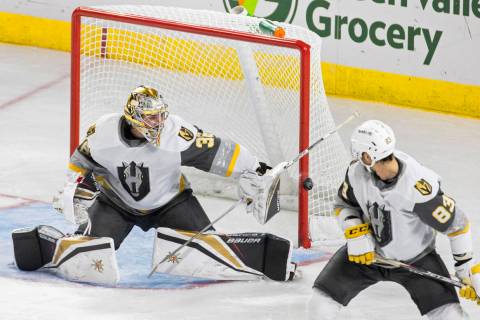 Silver Knights goaltender Logan Thompson (36) makes a save in the second period during an AHL h ...