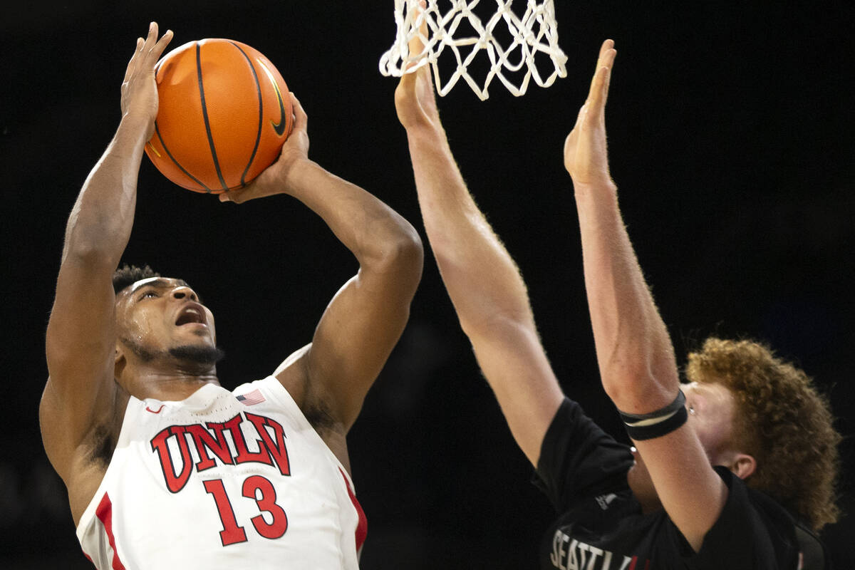 UNLV Rebels guard Bryce Hamilton (13) shoots against Seattle Redhawks guard Kobe Williamson (33 ...