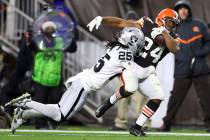 Raiders free safety Trevon Moehrig (25) tackles Cleveland Browns running back Nick Chubb (24) a ...