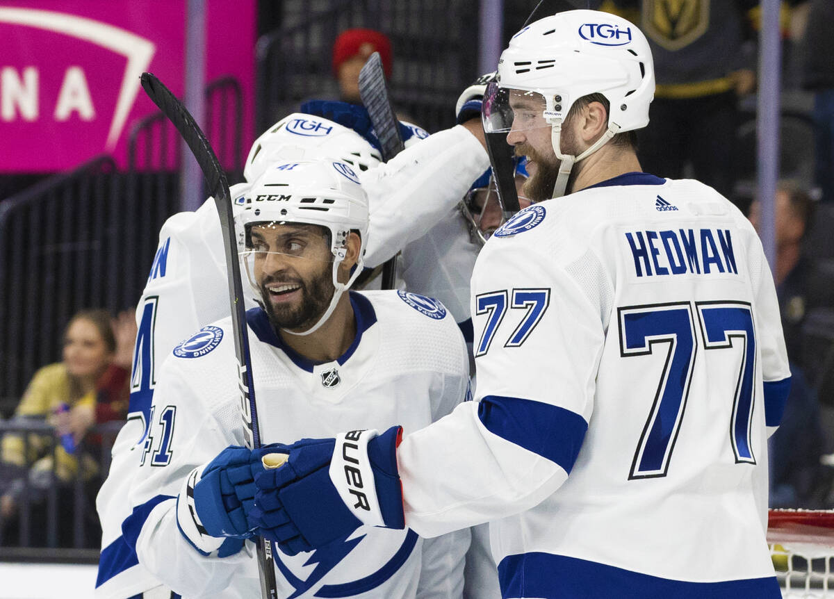 Tampa Bay Lightning left wing Pierre-Edouard Bellemare (41) celebrates with teammates after bea ...