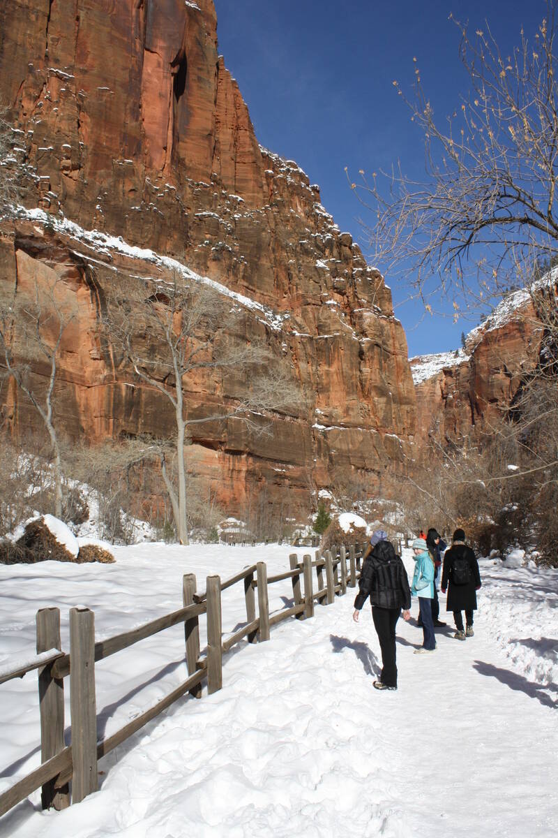 Visitors enjoying the snow-covered Riverside Walk in Zion Canyon. (Deborah Wall)