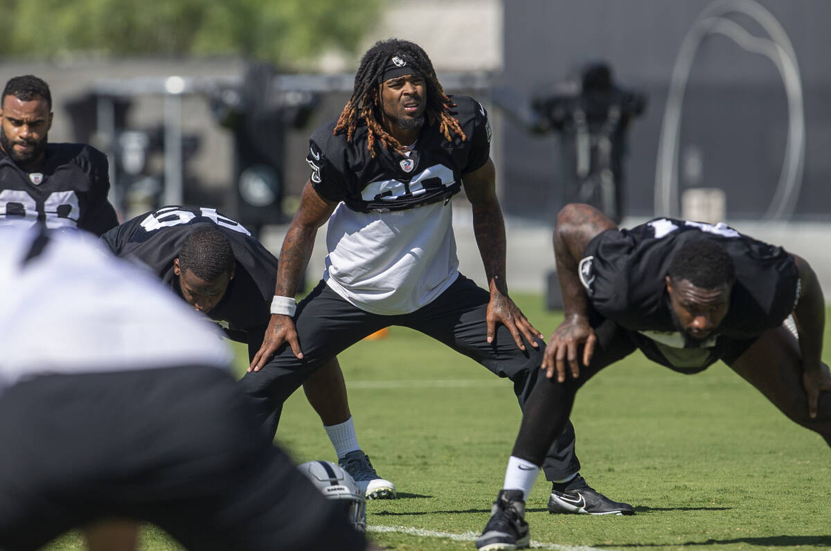 Raiders cornerback Damon Arnette (20) stretches during a practice session at the Raiders Headqu ...