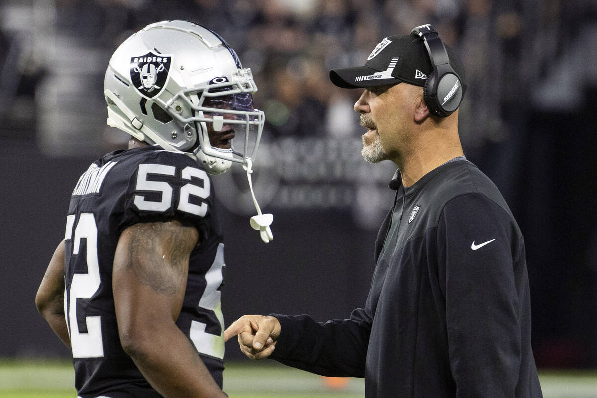 Raiders middle linebacker Denzel Perryman (52) hears from defensive coordinator Gus Bradley dur ...
