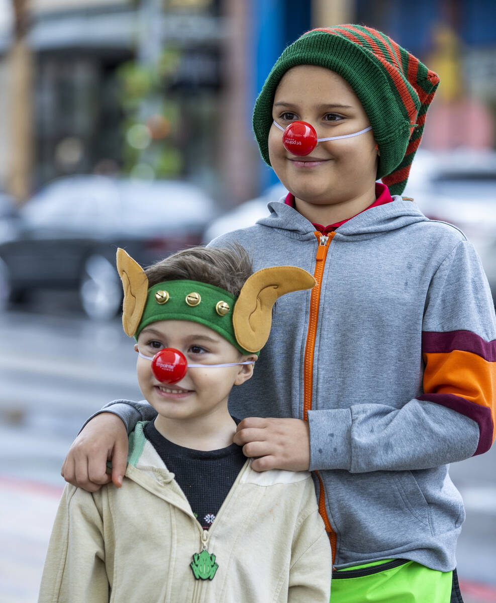 (From top) Brighton, 11, and Anakin Galore, 5, are dressed for a Santa visit during some last m ...