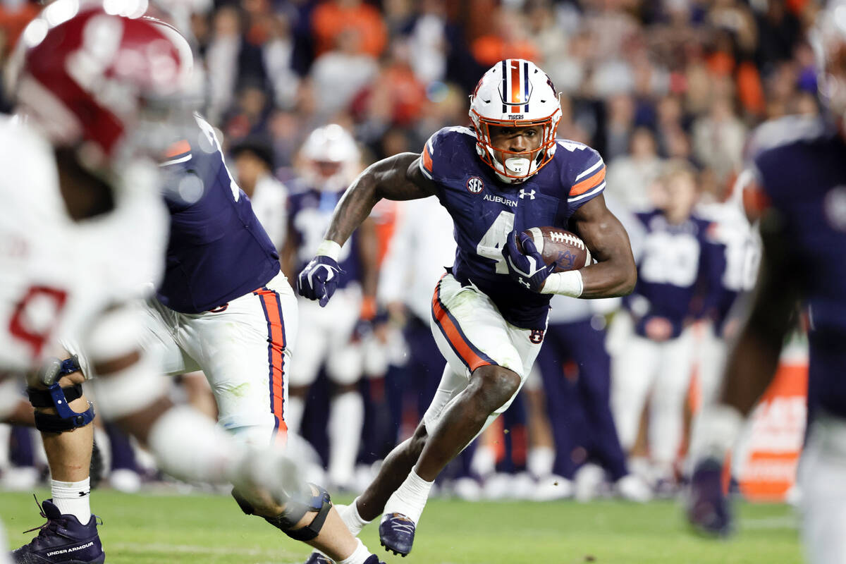 Auburn running back Tank Bigsby (4) carries the ball against Alabama during the second half of ...