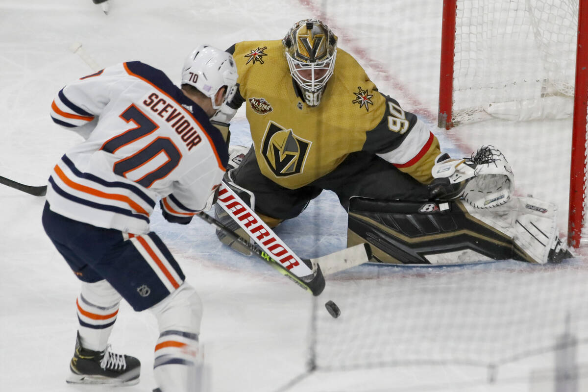 Golden Knights goaltender Robin Lehner (90) makes a save against Edmonton Oilers center Colton ...