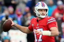 Buffalo Bills quarterback Josh Allen passes in the first half of an NFL football game against t ...