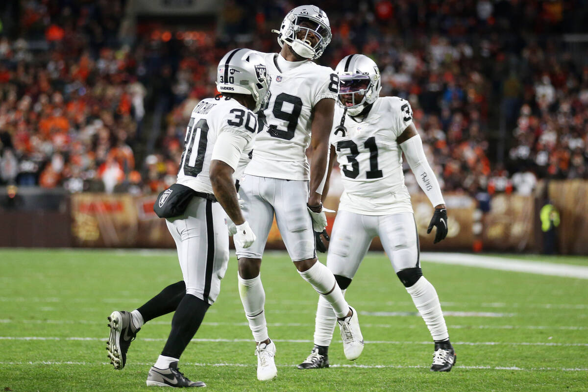 Raiders wide receiver Bryan Edwards (89) celebrates a touchdown catch with =running back Jalen ...