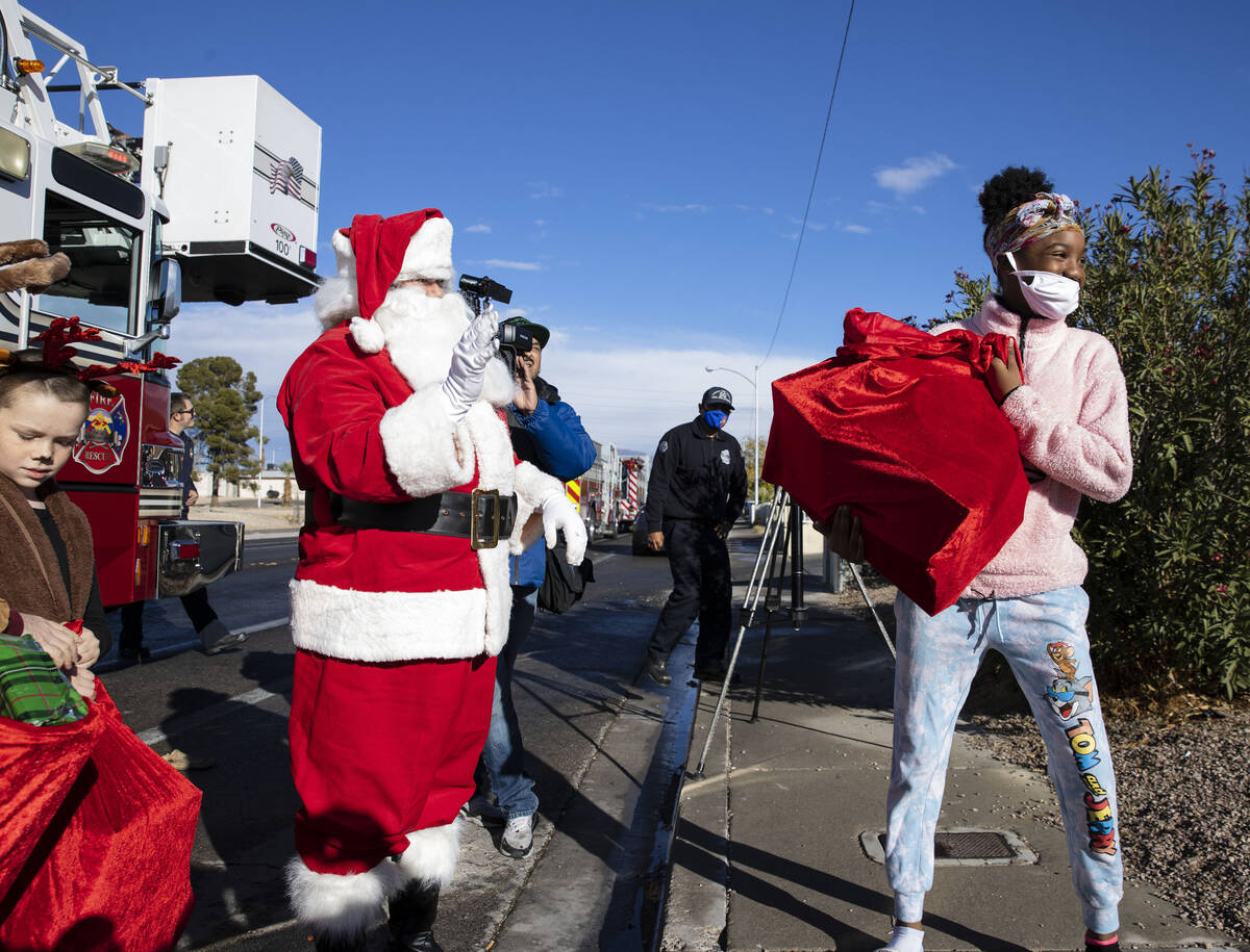 Promise Pardue receives gifts from Santa at her residence on Friday, Dec. 24, 2021, in North La ...