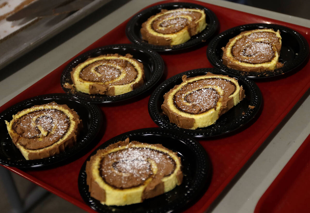 Yule log cakes are ready to be served during the annual Christmas Day meal, Saturday, Dec. 25, ...