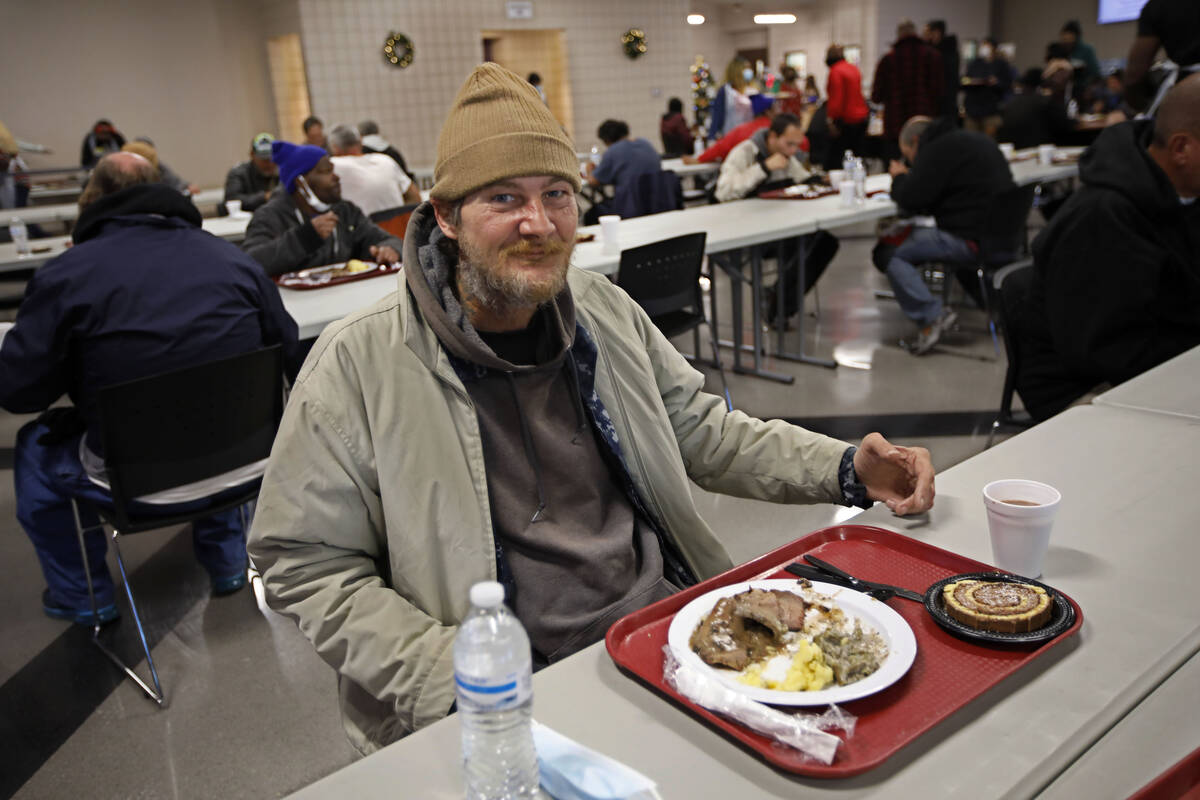 David Daughdrty poses for a photo, Saturday, Dec. 25, 2021, portion    eating during the yearly  Chr ...